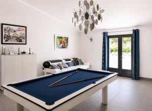 a living room with a pool table and a couch at villa plaisirs in Saint Paul de Vence