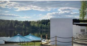 two tents sitting next to a body of water at Hotel Lahnajärvi in Lahnajärvenkylä +5 photos