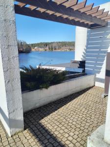 a porch with a view of a lake at Hotel Lahnajärvi in Lahnajärvenkylä
