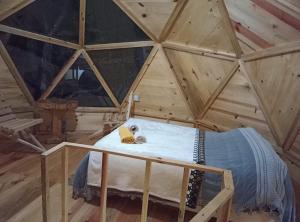 a room with a bed in a wooden attic at Hongos mágicos in San Mateo Río Hondo +15 photos
