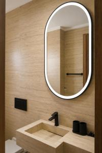 a bathroom with a sink and a mirror at Dakhla Sur Mer Hôtel in Dakhla +67 photos