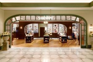 a store with an entrance to a shop with flowers in a room at The Reserve at Park MGM in Las Vegas +52 photos