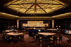 a restaurant with tables and chairs and a large ceiling at The Reserve at Park MGM in Las Vegas