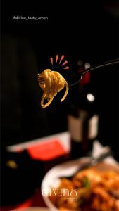 a fork with a yellow pasta object on it at Serail Hotel in Ehden +21 photos