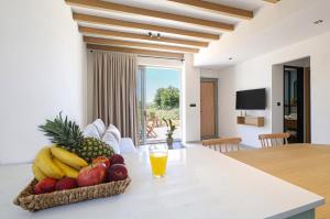 a bowl of fruit on a table in a living room at Villa Emanouill Nopigia in Kissamos