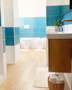 a bathroom with a sink and a toilet at Casa Vacanze Formia in Formia +21 photos