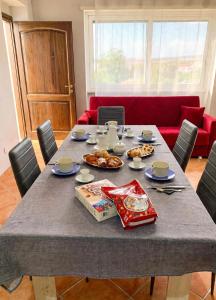 a dining room table with food on top of it at Casa Vacanze Formia in Formia