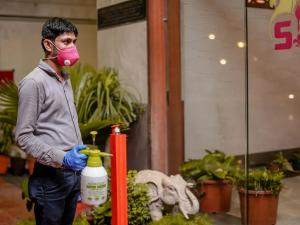 a man wearing a gas mask and holding a fire hydrant at Hotel Pleasure Palace in Indore +16 photos