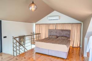 a bedroom with a bed in a room at ANDE Apartments Hotel in Gonio +206 photos