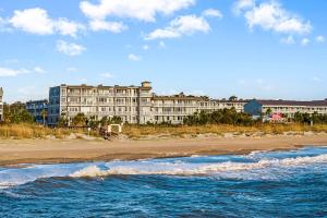 a view of a hotel from the beach at The Gardens 703 in Tybee Island