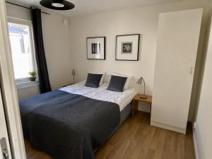a bedroom with a bed with two pillows on it at Hällestrand Village in Strömstad