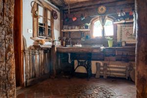 a kitchen with a wooden counter and a window at Etno Kuca Bajka in Mataruška Banja +24 photos