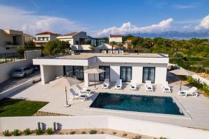 an aerial view of a villa with a swimming pool at Villa Meritus in Gramače