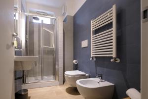 a bathroom with a toilet and a shower and a sink at Hotel Olivò in Bitritto +90 photos