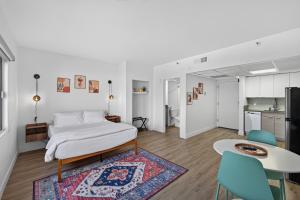 a bedroom with a bed and a table and chairs at Astral Desert Retreats in Mesa