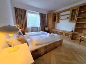 a bedroom with a bed and a lamp on a table at Splendida dimora vista lago in St. Moritz