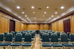 a conference room with chairs and wooden walls at Hotel Ponta Delgada in Ponta Delgada +23 photos