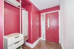 a room with a red wall and a red door at Finch Terminal Station 1min -Yonge and Finch Intersection in Toronto +26 photos