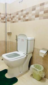 a bathroom with a toilet and a glass shower at Ella Scenic Heights in Ella +31 photos