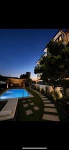 a swimming pool in the yard of a house at Villa Dalaman Müjgan Hanım Konağı in Dalaman