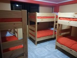 a room with three bunk beds in a room at Pakakuna in Urubamba +9 photos