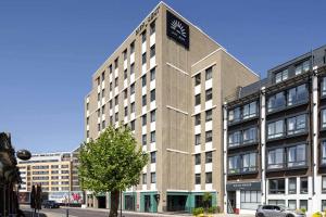 a building with a sign on the top of it at Diff-Rent Studios with gym & Fast Access to Central London & Wembley in Harrow +43 photos