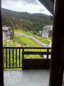 a view from the balcony of a house at Tania nice chalettt garden view in Courchevel