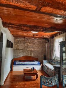 a bedroom with a bed and a table at Border Bridge House in Tui