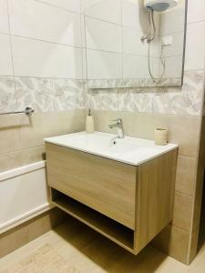 a bathroom with a sink and a mirror at La casetta in Teulada