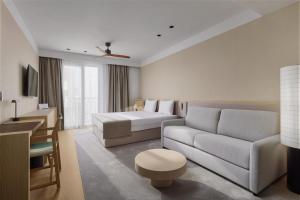 a living room with a couch and a bed at Viale in Budva