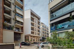 an apartment building in the middle of a street at Viale in Budva