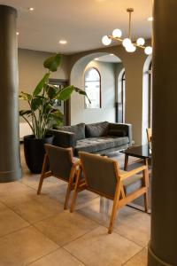 a living room with a couch and a table at Hotel Copahue in Junín