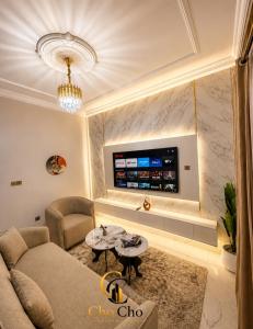 a living room with a couch and a table at ChoCho Apartments in Limbe
