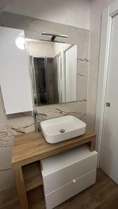 a bathroom with a sink and a mirror at Mercato29Home in Lucera +14 photos