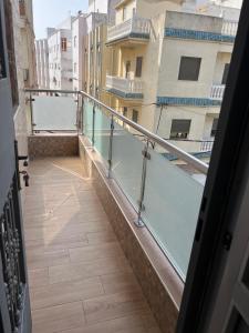 a balcony with a view of a building at Jad Moon Stay in Fnidek