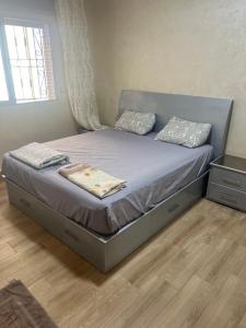 a bed in a bedroom with a mattress and a window at Jad Moon Stay in Fnidek