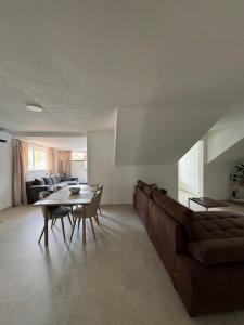 a living room with a couch and a table at Adriatic Retreat Mljet in Polače
