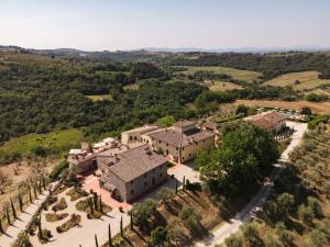an aerial view of a large house with trees at The Podere Wine Resort Chianti in Barberino di Val dʼElsa