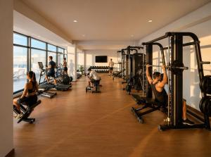 a group of people exercising in a gym at INFINITY Sea View Luxury SUITE in Mamaia Sat/Năvodari