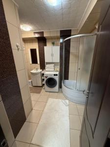 a small bathroom with a toilet and a sink at Brasov Place in Braşov +44 photos
