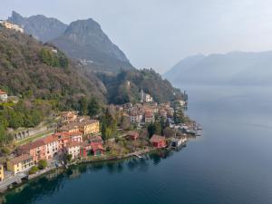 a small town on the shore of a lake at Mirafiume - Lugano Lake in Valsolda