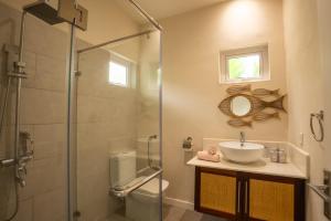 a bathroom with a sink and a shower at ELOMY VILLA in Albion +73 photos