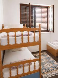 a bedroom with two bunk beds and a window at Bonita in Mostar