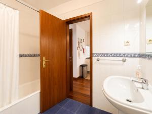 a bathroom with a sink and a toilet at Studio Gerês in Geres +22 photos