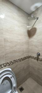 a bathroom with a toilet and a shower at Smart Studio - BResidences ICE BSD in Tjilandak +35 photos