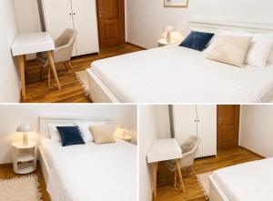 a white bedroom with two beds and a desk at Villa "Lala" in Ljubuški