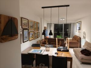 a living room with a table and a couch at Summer Tower 102 in Punta del Este +83 photos