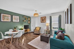a living room with a blue couch and a table at Casa Oasis Temple 3BR 2BA Work Ready in Temple