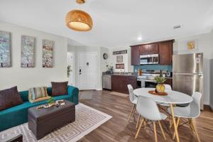 a living room with a couch and a table at Casa Oasis Temple 3BR 2BA Work Ready in Temple