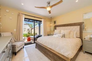 a bedroom with a large bed and a window at Luxury House with Ocean View in Cabo San Lucas +57 photos